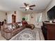 Inviting living room featuring a comfortable sofa, decorative rug, and elegant accents at 1936 Compass Flower Way, Ocoee, FL 34761