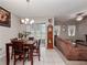 Open-concept living space featuring a dining area with a seamless flow into the living room at 1936 Compass Flower Way, Ocoee, FL 34761