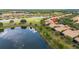 Scenic aerial view highlighting the property's lakeside location within the community at 2376 Palm Tree Dr, Kissimmee, FL 34759