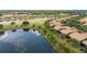 Scenic aerial view highlighting the property's lakeside location within the community at 2376 Palm Tree Dr, Kissimmee, FL 34759