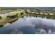 Scenic aerial view highlighting the property's lakeside location within the community at 2376 Palm Tree Dr, Kissimmee, FL 34759