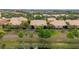 Aerial view showcasing the property's location within a lush, green community at 2376 Palm Tree Dr, Kissimmee, FL 34759