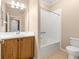 Well-maintained bathroom with vanity, full tub, and neutral color palette at 2376 Palm Tree Dr, Kissimmee, FL 34759
