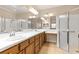Spacious bathroom featuring a double vanity, ample lighting, and a glass-enclosed shower at 2376 Palm Tree Dr, Kissimmee, FL 34759