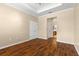 Bedroom featuring wood floors, neutral paint, and multiple doorways at 2376 Palm Tree Dr, Kissimmee, FL 34759