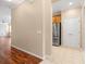 The entryway leads to a living area and a kitchen featuring stainless steel appliances at 2376 Palm Tree Dr, Kissimmee, FL 34759