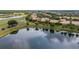 Scenic lake view homes offering serene water views, lush greenery, and community golf course at 2376 Palm Tree Dr, Kissimmee, FL 34759