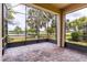 Relaxing screened lanai offering expansive views of the community lake at 2376 Palm Tree Dr, Kissimmee, FL 34759