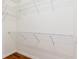 Walk-in closet with wire shelving and wood floors at 2376 Palm Tree Dr, Kissimmee, FL 34759