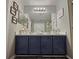 Bathroom featuring a double vanity with granite counters at 2531 Old Kent Cir, Kissimmee, FL 34758