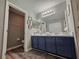 Bathroom featuring a double vanity and a separate toilet room at 2531 Old Kent Cir, Kissimmee, FL 34758