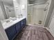 Beautiful bathroom featuring a dual sink vanity and glass-enclosed shower at 2531 Old Kent Cir, Kissimmee, FL 34758