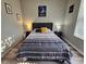Bedroom features a queen bed, matching end tables, and decorative Star Wars wall art at 2531 Old Kent Cir, Kissimmee, FL 34758