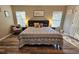 Bedroom featuring a large bed and two bedside tables at 2531 Old Kent Cir, Kissimmee, FL 34758
