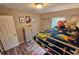 Bedroom with a bunk bed, colorful Mario themed bedding, and neutral color scheme at 2531 Old Kent Cir, Kissimmee, FL 34758