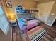 Bright bedroom with a bunk bed, light wood floors and ample natural light at 2531 Old Kent Cir, Kissimmee, FL 34758