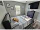 Comfortable bedroom with mounted TV, ceiling fan, and wood-look floors at 2531 Old Kent Cir, Kissimmee, FL 34758