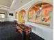Community game room featuring a foosball table and painted arches at 2531 Old Kent Cir, Kissimmee, FL 34758
