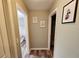 Upstairs hallway with views into the bathroom and other bedroom at 2531 Old Kent Cir, Kissimmee, FL 34758