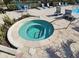 Relaxing hot tub area with nearby poolside seating and lush landscaping at 2531 Old Kent Cir, Kissimmee, FL 34758