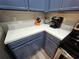Bright kitchen features stainless steel appliances, coffeemaker and white countertops at 2531 Old Kent Cir, Kissimmee, FL 34758
