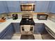 Bright kitchen features stainless steel appliances, oven and white countertops at 2531 Old Kent Cir, Kissimmee, FL 34758