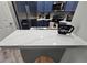 Bright kitchen features stainless steel appliances, sink and white countertops at 2531 Old Kent Cir, Kissimmee, FL 34758