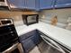 Bright kitchen features stainless steel appliances, oven and white countertops at 2531 Old Kent Cir, Kissimmee, FL 34758