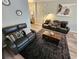 Open living room with stylish sofas, a contemporary rug, and tasteful wall decor at 2531 Old Kent Cir, Kissimmee, FL 34758