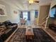 Spacious living room with a view of the dining area and kitchen, featuring modern furnishings at 2531 Old Kent Cir, Kissimmee, FL 34758
