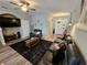 Cozy living room with modern sofas, ceiling fan, and view of the foyer at 2531 Old Kent Cir, Kissimmee, FL 34758