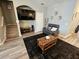 Well-lit living room with a large TV, comfortable seating, and modern decor at 2531 Old Kent Cir, Kissimmee, FL 34758