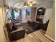 Comfortable living room featuring sofas, a ceiling fan, and a view of the dining area and kitchen at 2531 Old Kent Cir, Kissimmee, FL 34758