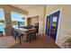 Outdoor kitchen area with a bar, grill, and seating next to the pool at 2531 Old Kent Cir, Kissimmee, FL 34758