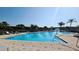 Large community pool with a fountain feature and ample seating for relaxation at 2531 Old Kent Cir, Kissimmee, FL 34758