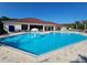 Spacious pool with a fountain feature in front of the clubhouse and lounge seating at 2531 Old Kent Cir, Kissimmee, FL 34758