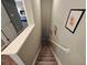 Carpeted staircase leading to an upper level with wall decor, and grey paint at 2531 Old Kent Cir, Kissimmee, FL 34758