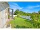 The well-maintained lawn looks out at the white fence and trees at 2642 Gild Dust Cir., Kissimmee, FL 34744