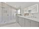 Spa-like bathroom with glass shower, double vanity, and stylish modern finishes at 2642 Gild Dust Cir., Kissimmee, FL 34744