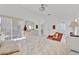 Bright bedroom with ensuite bath features large windows and neutral color palette at 2642 Gild Dust Cir., Kissimmee, FL 34744