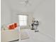 Cozy bedroom featuring a comfortable sofa, a desk, and a bright window at 2642 Gild Dust Cir., Kissimmee, FL 34744