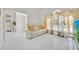 Bright living room with a comfortable sofa, modern curtains, and large picture window at 2642 Gild Dust Cir., Kissimmee, FL 34744