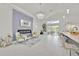 Open concept living space with fireplace, breakfast bar, and sliding doors to the pool at 2642 Gild Dust Cir., Kissimmee, FL 34744