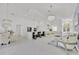 Expansive open concept living area featuring marble floors, modern lighting, and luxurious decor at 2642 Gild Dust Cir., Kissimmee, FL 34744