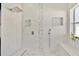Walk-in shower features tile, bench and niches at 2642 Gild Dust Cir., Kissimmee, FL 34744