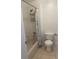 Bright bathroom featuring a shower and toilet with tile flooring at 2650 Patrician Cir, Kissimmee, FL 34746