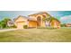 Charming two-story home boasting a well-manicured lawn, lush landscaping, and a two-car garage at 2650 Patrician Cir, Kissimmee, FL 34746