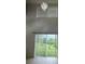 Bright living room with sliding glass doors offering backyard views at 2650 Patrician Cir, Kissimmee, FL 34746
