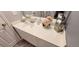 Bathroom vanity with quartz countertops and decorative flowers at 2729 Club Cortile Cir, Kissimmee, FL 34746