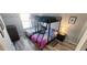 Bright bedroom featuring a bunk bed, dresser, and overhead lighting at 2729 Club Cortile Cir, Kissimmee, FL 34746